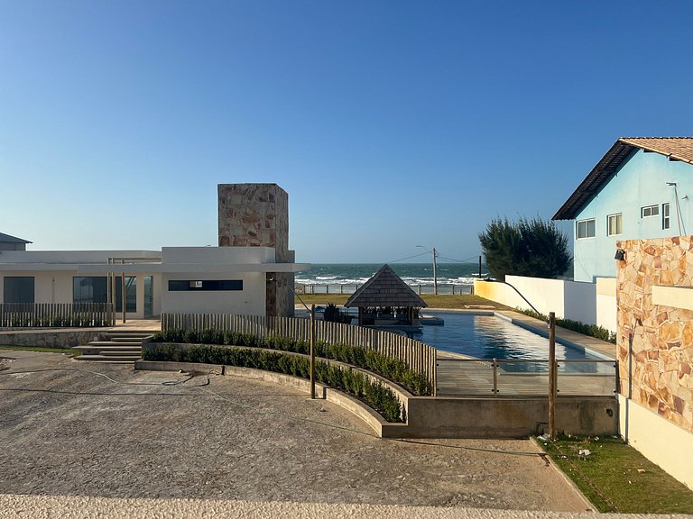 Casa de luxo em condomínio pé na areia com 4 suítes, roftoop